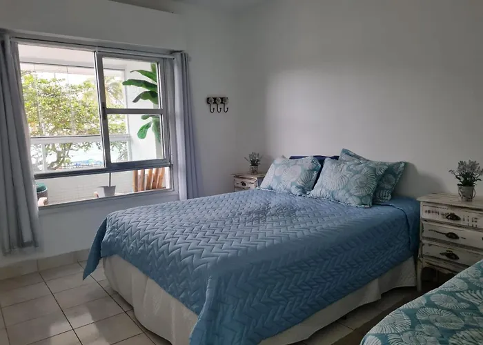 Exclusiva Varanda pé na areia Pitangueiras Guarujá